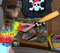 Kelly gives the pirate pinata a last wack!