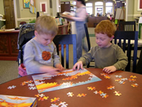 Doing a puzzle with Cole at the library...