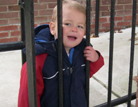 Waiting for Tommy at his school.