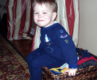 Nicholas in a basket.