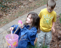 Daniele and Trevor gather Easter eggs with their cousins.
