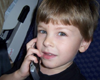 Tommy on the plane talking to Granny Rosie.