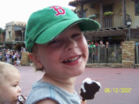 tommy & nicholas enjoying the parade and their ice cream