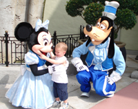 Minnie gives Nicholas a hug.