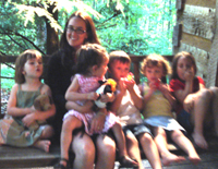 Randi leads a song on the porch swing.