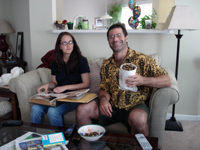 Randi checks out old photo albums while Todd pigs out on boiled peanuts.