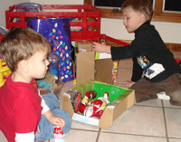 Nicholas C. and Tommy check out the loot.
