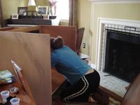Cindy constructs new kitchen cabinets.