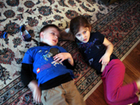Tommy and Daniele watch TV.