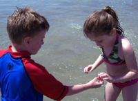 Daniele and Tommy hunting for seashells.