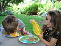 Todd cut up a delicious mango for the kids.