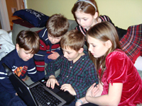 The Callahan Cousins track Santa's path on the web.