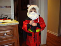 Tommy makes his own Santa outfit.