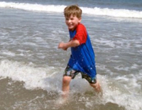 Tommy loves the surf.