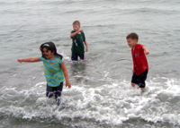 Cousins splashing in Maine.