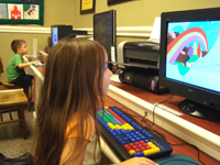 Ophelia and Nicholas work the computers at the library.