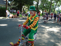 A clown goes by.