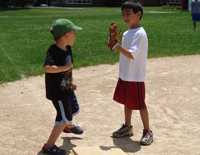 Nick and friend play softball.