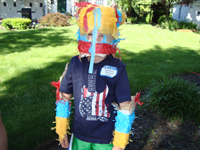 Tommy wears the pinata.