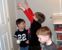 Nick C, Tommy and Nick B play b-ball.