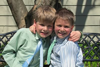 Tommy and Nicholas smile for the Easter Bunny.