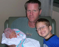 Trevor visits his newest cousin!