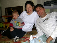 Here's the whole family. Nicholas is the little blue button next to Mike's hand.