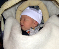 Nicholas is bundled up to go the doctor.