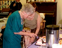 Flo cuts the cake