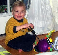 Tommy loves to fix his toys.