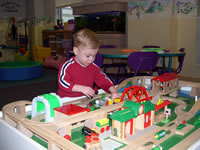 Tommy has fun in the playroom while Nicholas is in the hospital.